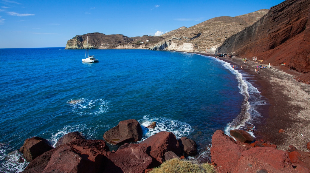 Red Beach which includes rugged coastline and general coastal views