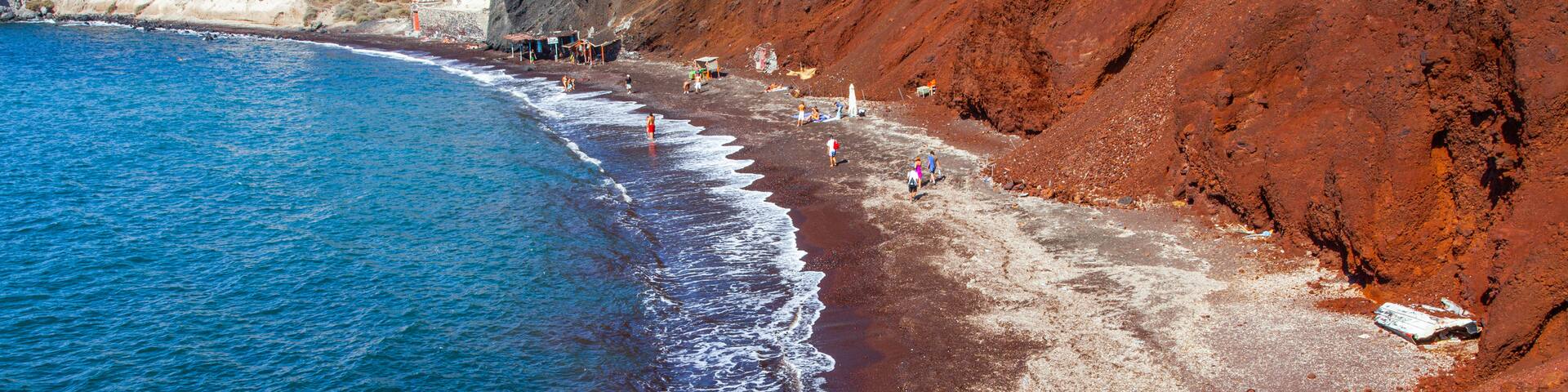 Red Beach which includes rocky coastline and general coastal views as well as an individual male
