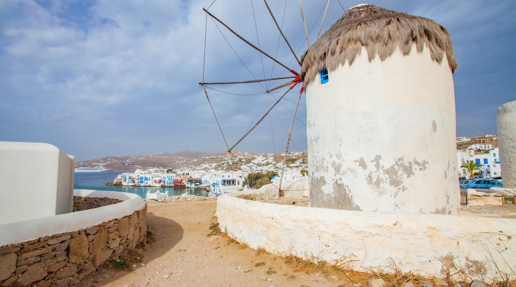 Windmills of Mykonos which includes a coastal town