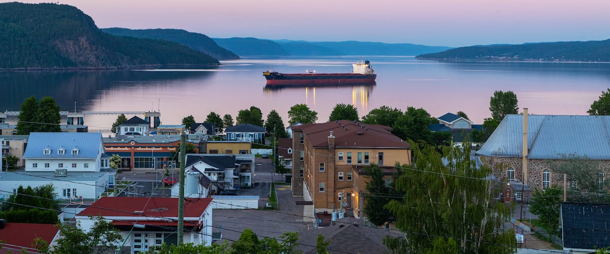 La Baie featuring a sunset, a coastal town and general coastal views