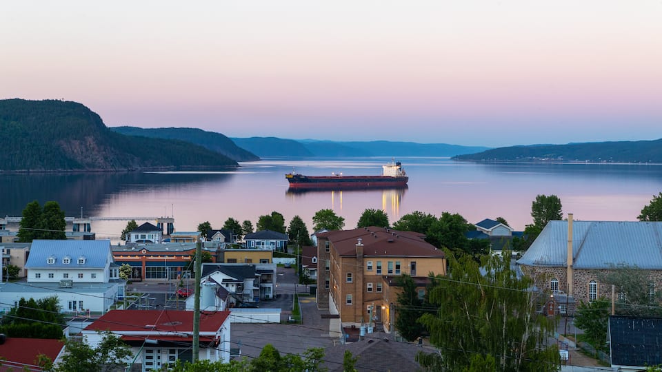La Baie featuring a sunset, a coastal town and general coastal views