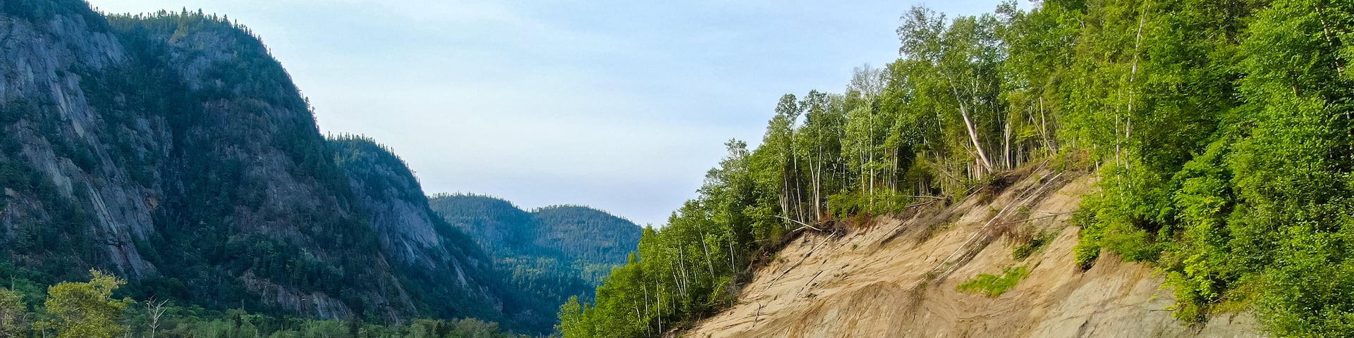 Parc National du Fjord-du-Saguenay which includes tranquil scenes and a river or creek