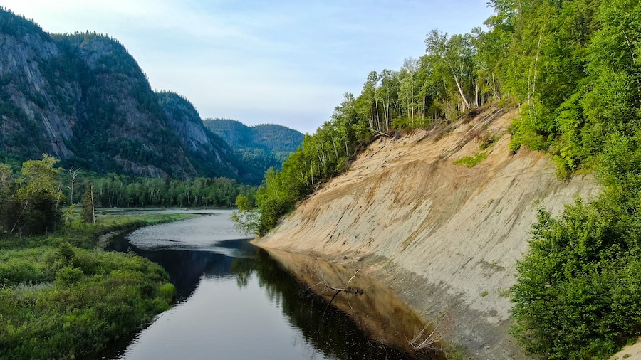 Parc National du Fjord-du-Saguenay which includes tranquil scenes and a river or creek