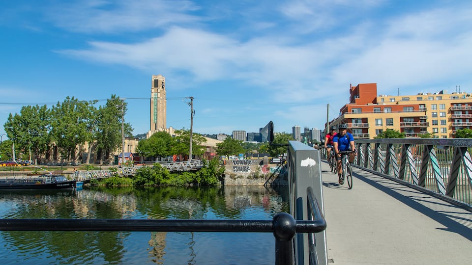 Lachine Canal National Historic Site showing a river or creek, cycling and a bridge