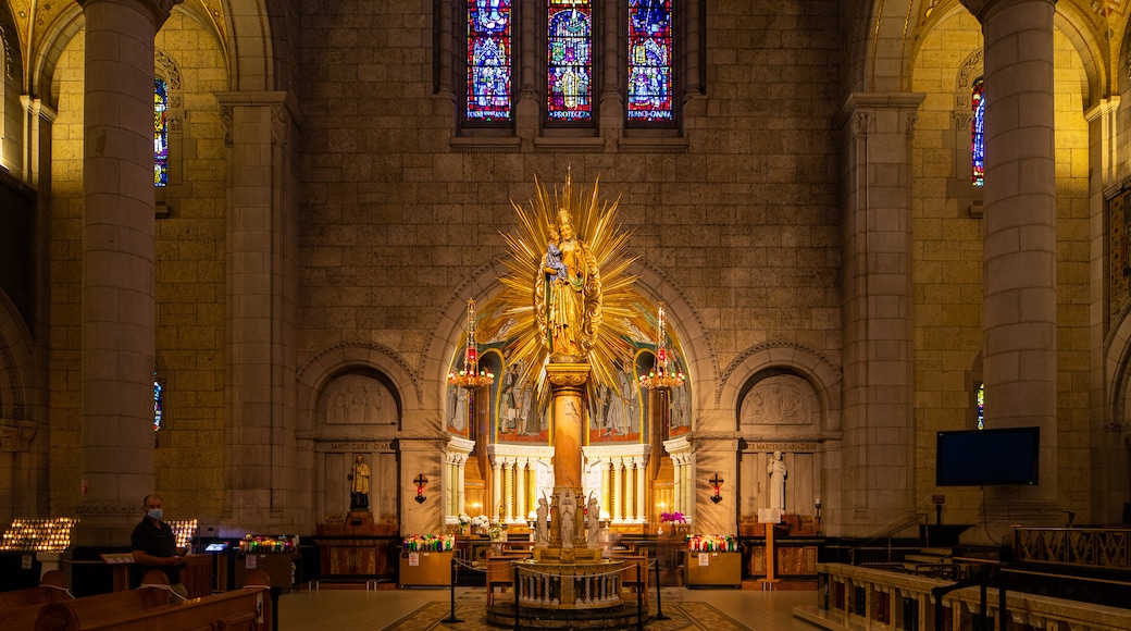 Basilica of Sainte-Anne-de-Beaupré featuring a church or cathedral, interior views and heritage elements