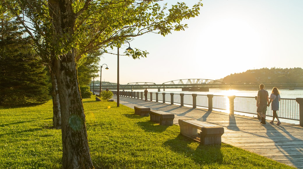 Saguenay featuring a river or creek, a sunset and a garden