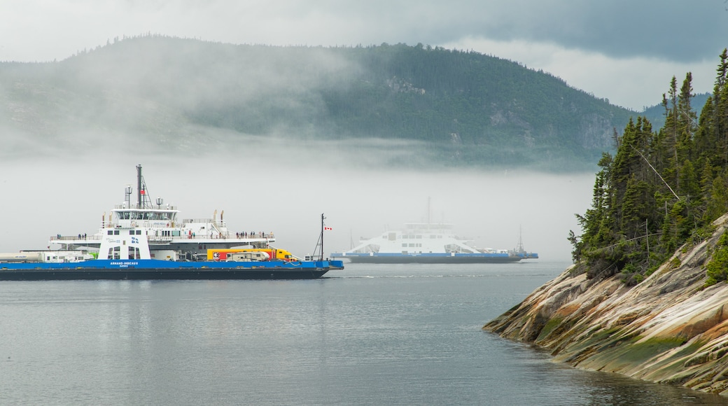 Tadoussac featuring mist or fog, boating and a lake or waterhole