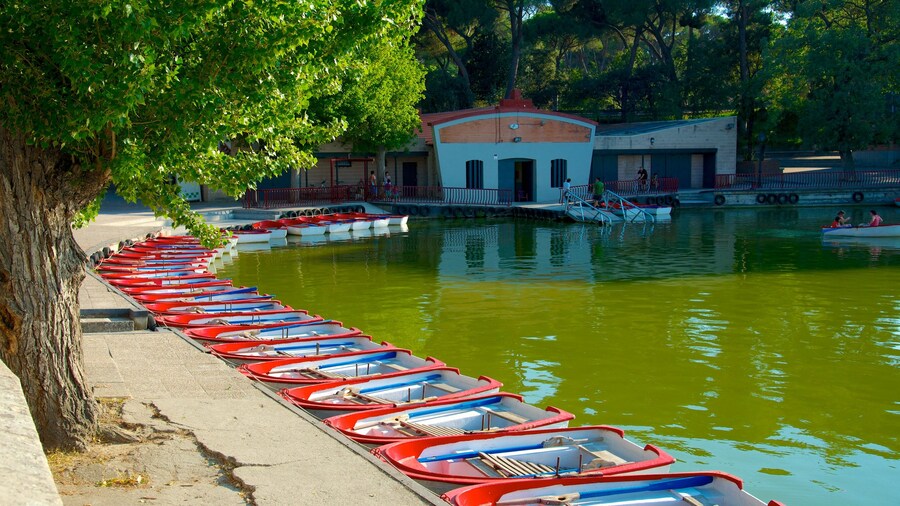 Scenic view of Casa de Campo lake in Madrid with boats and lush surroundings.