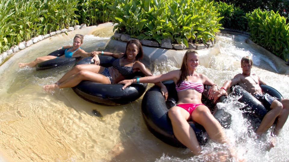 Schlitterbahn Waterpark showing a pool and a water park as well as a small group of people