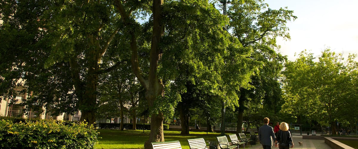 Gustav Adolf Square featuring a garden as well as a couple