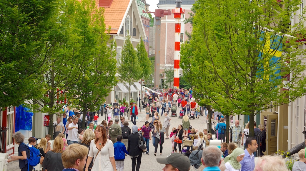 Liseberg Amusement Park which includes a city and street scenes as well as a large group of people