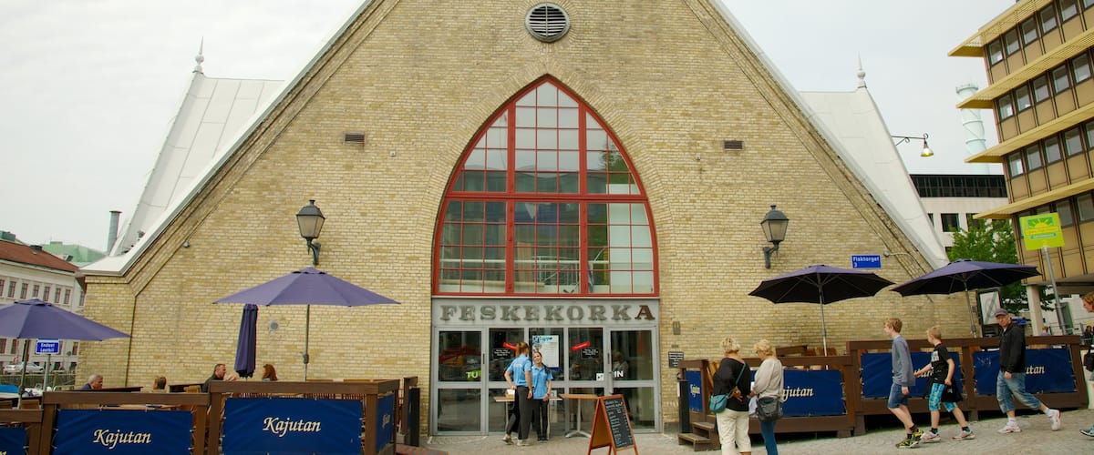 Fish Market featuring street scenes and markets as well as a small group of people