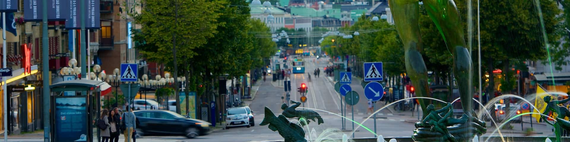Poseidon Statue which includes a fountain, a statue or sculpture and street scenes