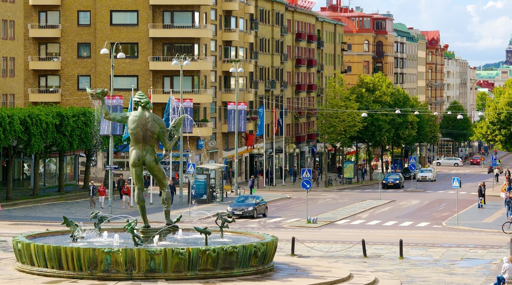 Poseidon Statue which includes a city, street scenes and a fountain