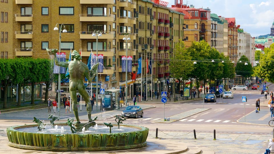 Poseidon Statue which includes a city, street scenes and a statue or sculpture
