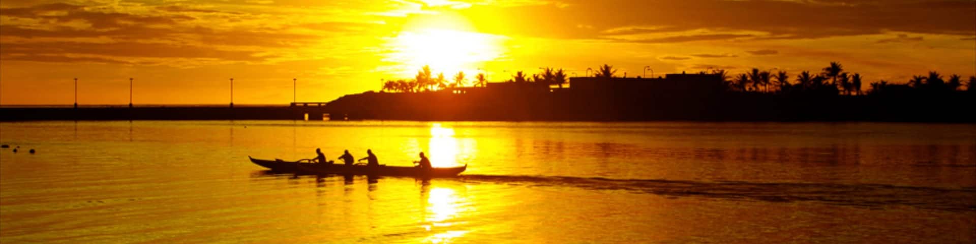 Guam featuring a sunset, kayaking or canoeing and general coastal views