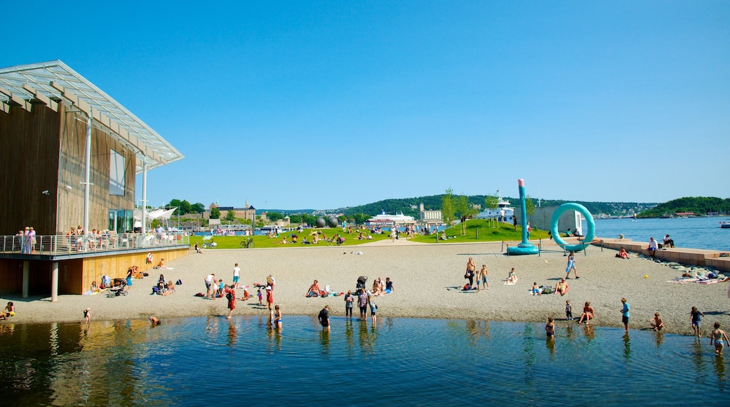 Oslo showing swimming, a beach and a coastal town