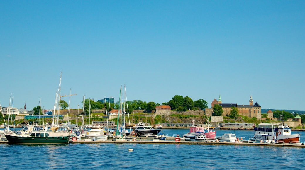 Aker Brygge featuring a marina and a coastal town