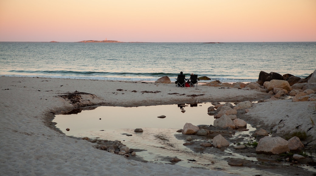 Crystal Crescent Beach showing a sunset, a sandy beach and general coastal views