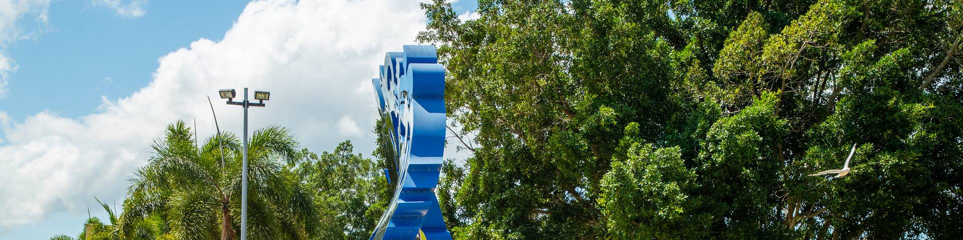 Cairns Esplanade showing outdoor art and a park as well as a couple