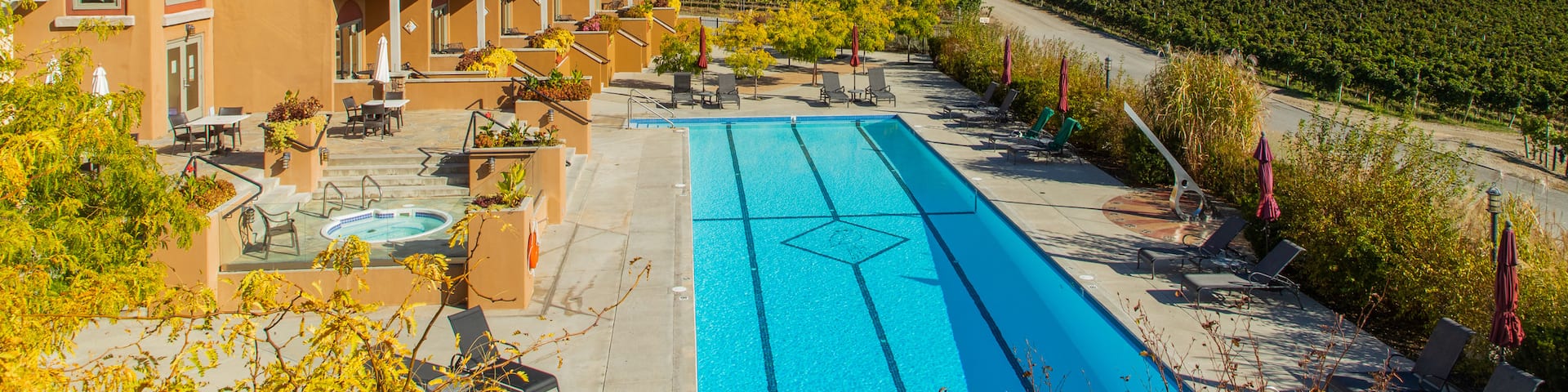 Burrowing Owl Estate Winery showing a pool, a hotel and farmland