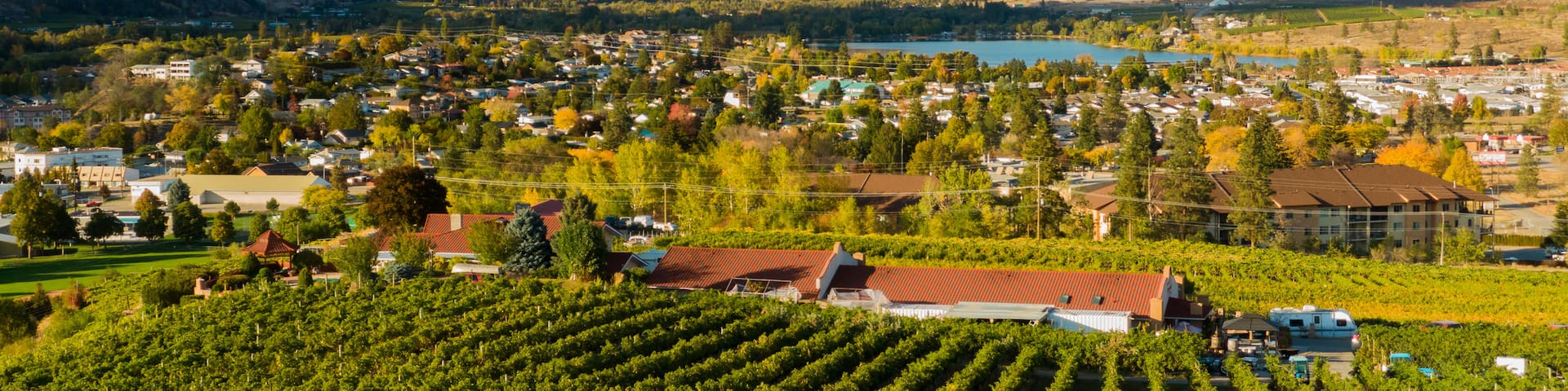 Oliver which includes a small town or village, farmland and landscape views