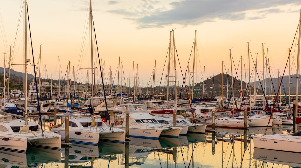 Coral Sea Marina featuring a bay or harbor and a sunset