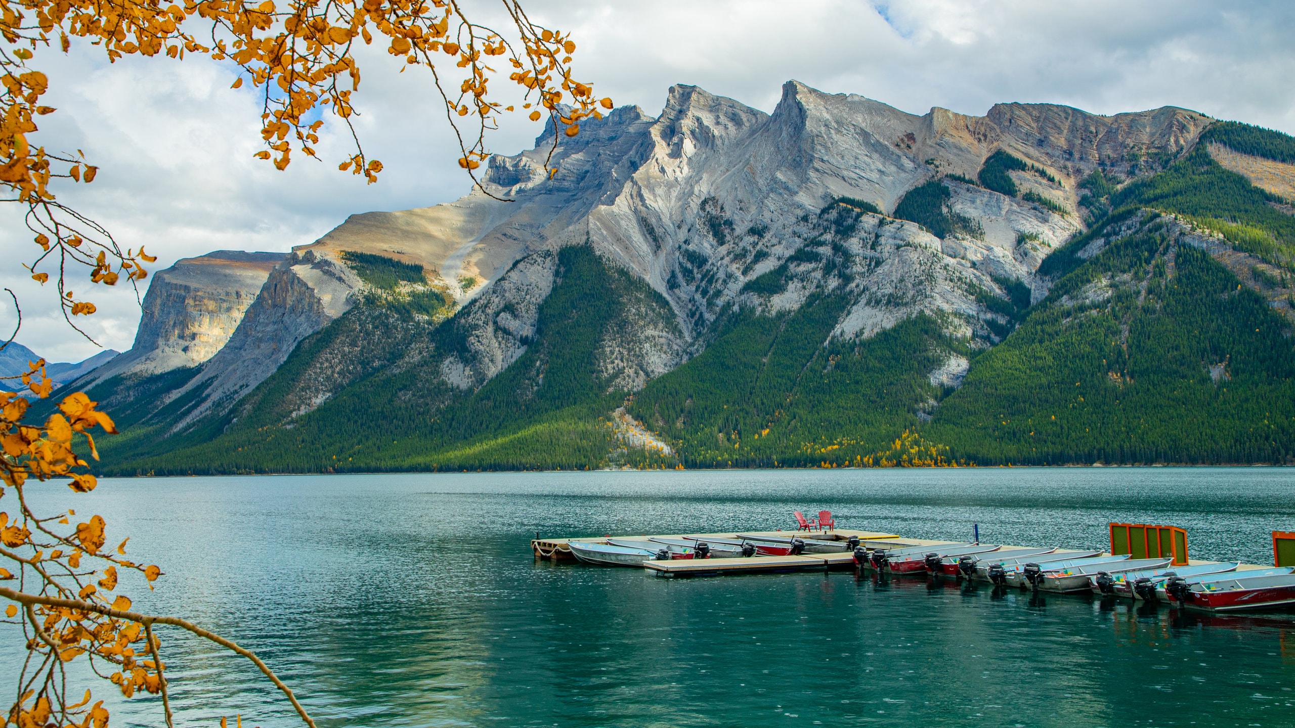 Lake Minnewanka featuring a lake or waterhole and mountains