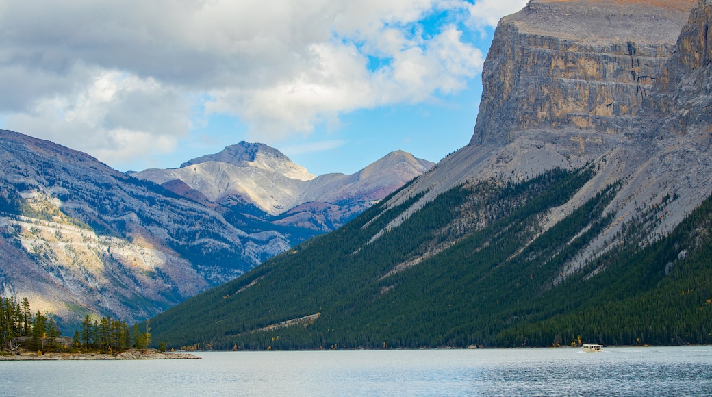 Lake Minnewanka featuring mountains and a lake or waterhole