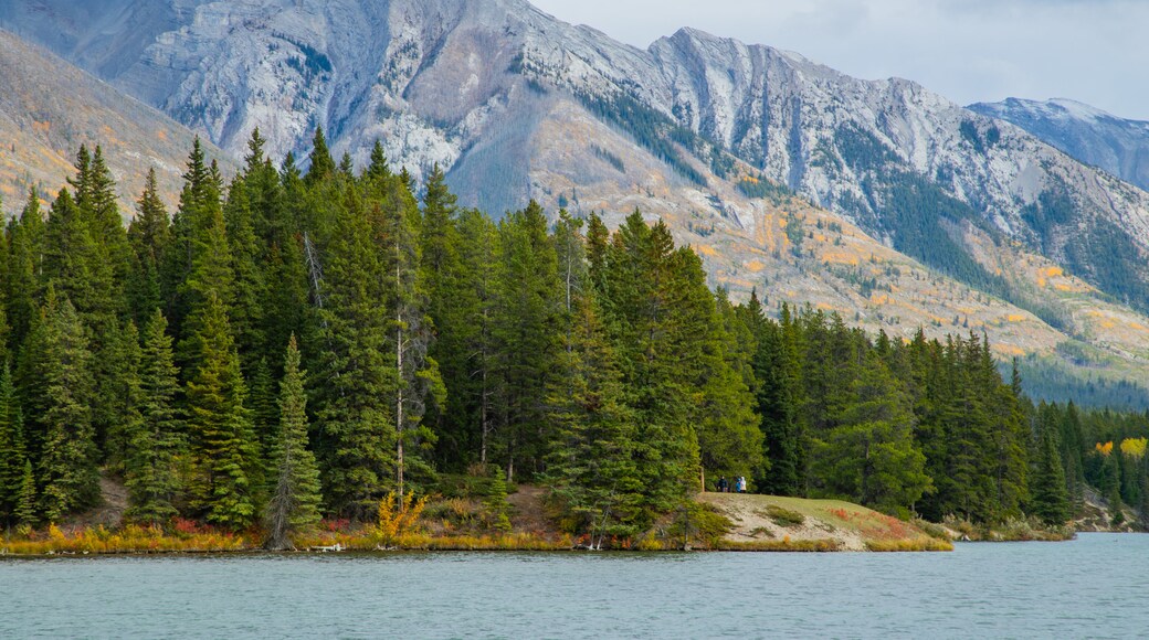 Minnewanka Loop / Lake Johnson featuring mountains and a lake or waterhole