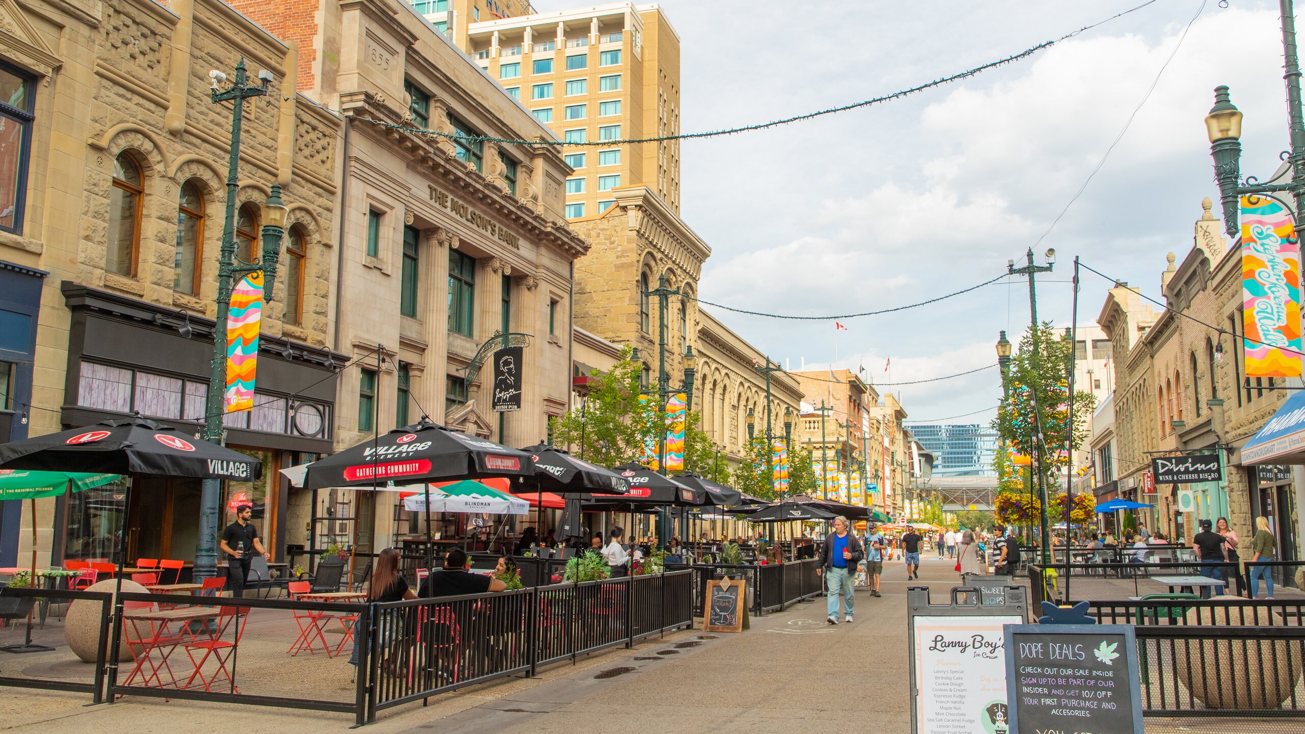 Stephen Avenue featuring heritage architecture, a city and street scenes