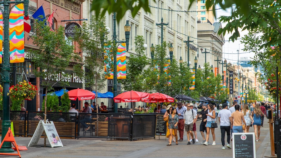 Stephen Avenue featuring street scenes and a city as well as a small group of people