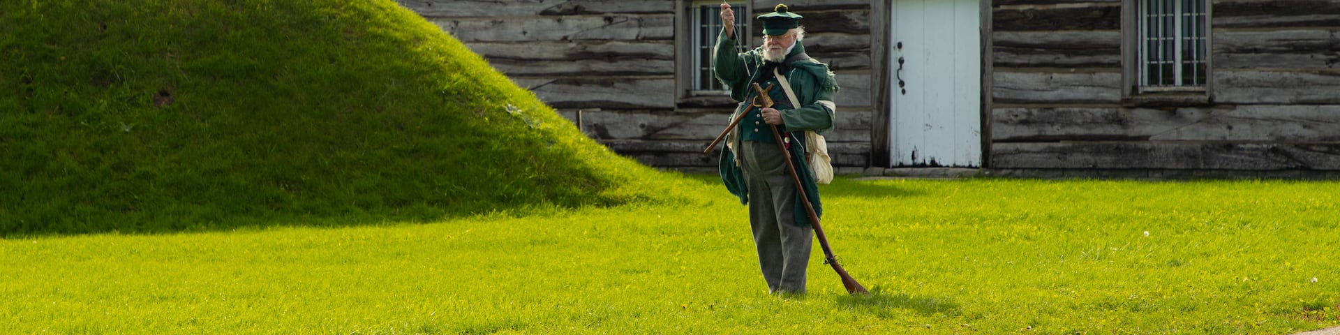 Fort George National Historic Site showing a small town or village and heritage elements as well as an individual male