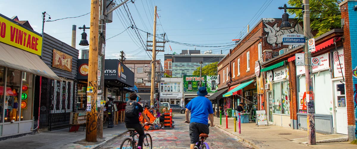 Kensington Market featuring street scenes and cycling as well as a couple