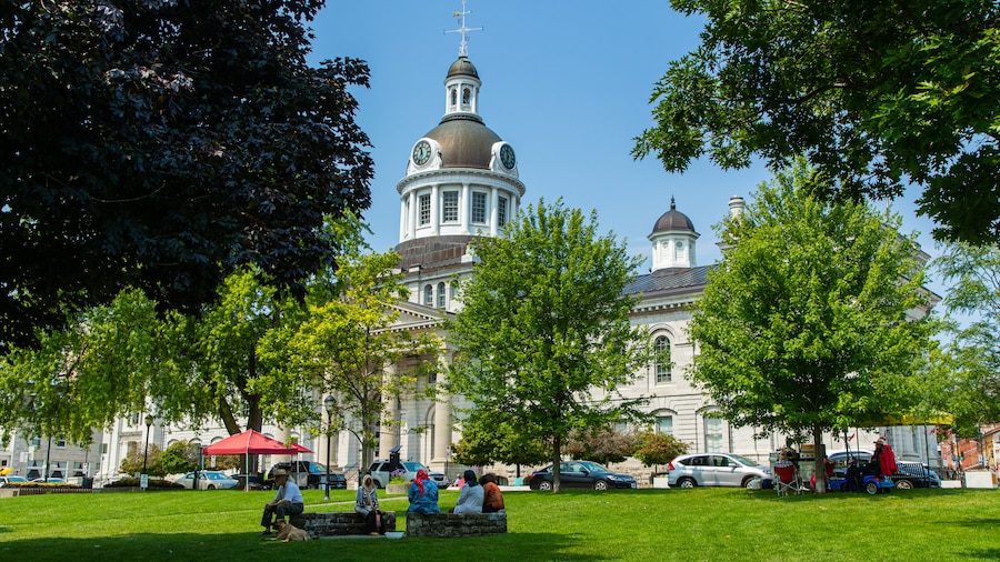 Kingston Waterfront which includes a park and heritage architecture as well as a small group of people