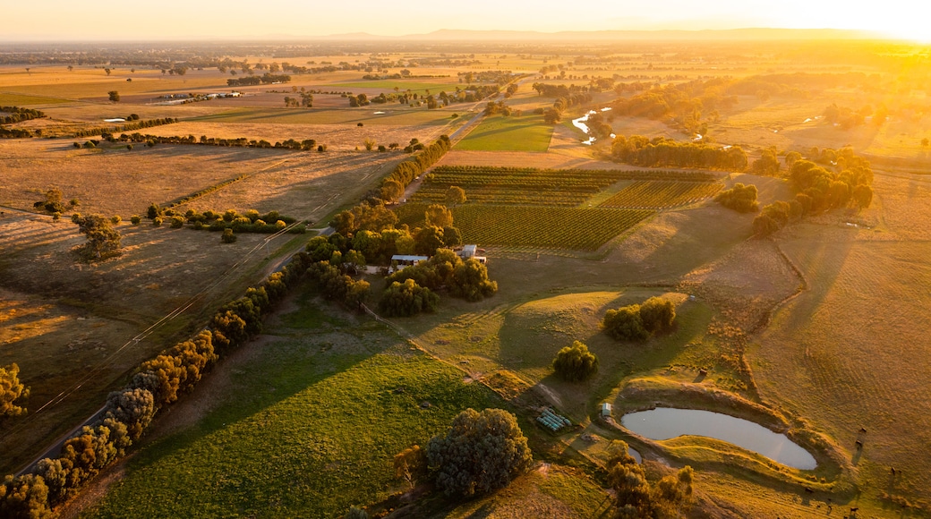 Australia featuring landscape views, a sunset and farmland