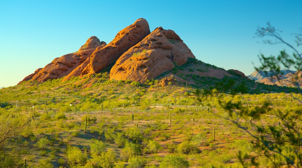 Hole in the Rock which includes mountains and desert views