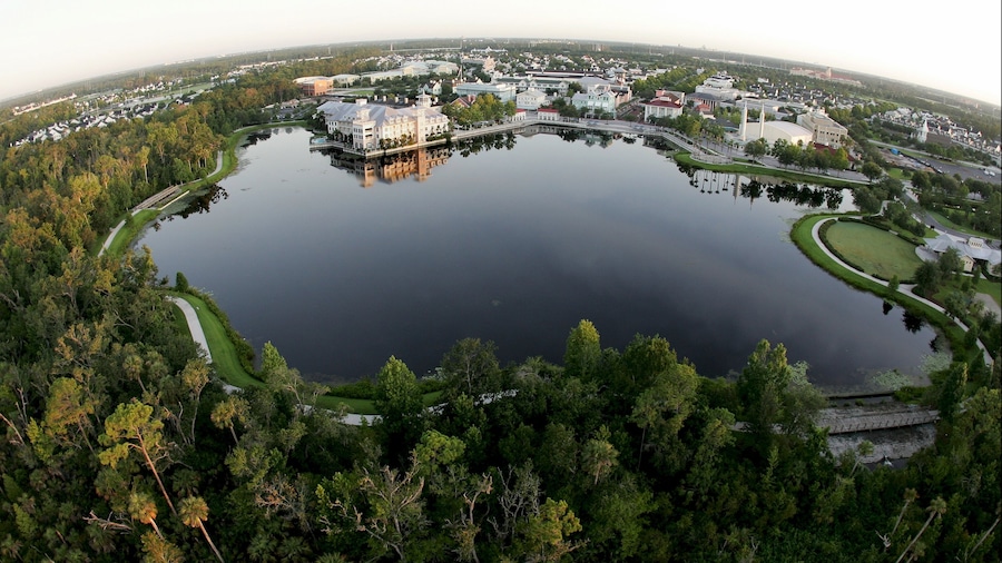 Celebration which includes a lake or waterhole, landscape views and a small town or village
