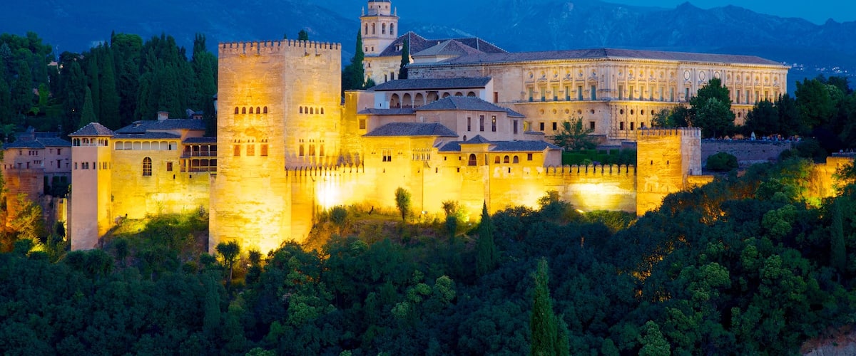 Mirador de San Nicolas which includes night scenes, heritage architecture and a castle