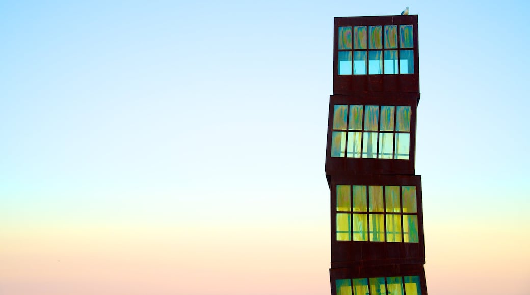 Barceloneta Beach featuring a sunset and outdoor art