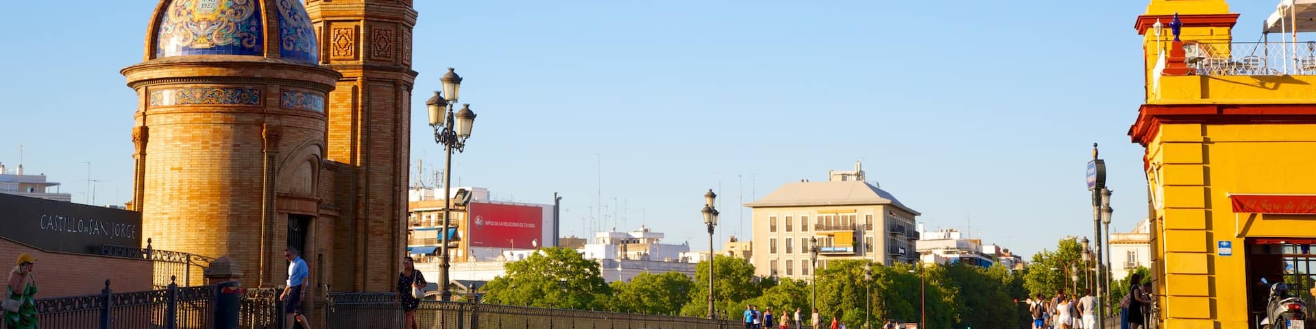 Triana Bridge featuring a bridge, a church or cathedral and street scenes