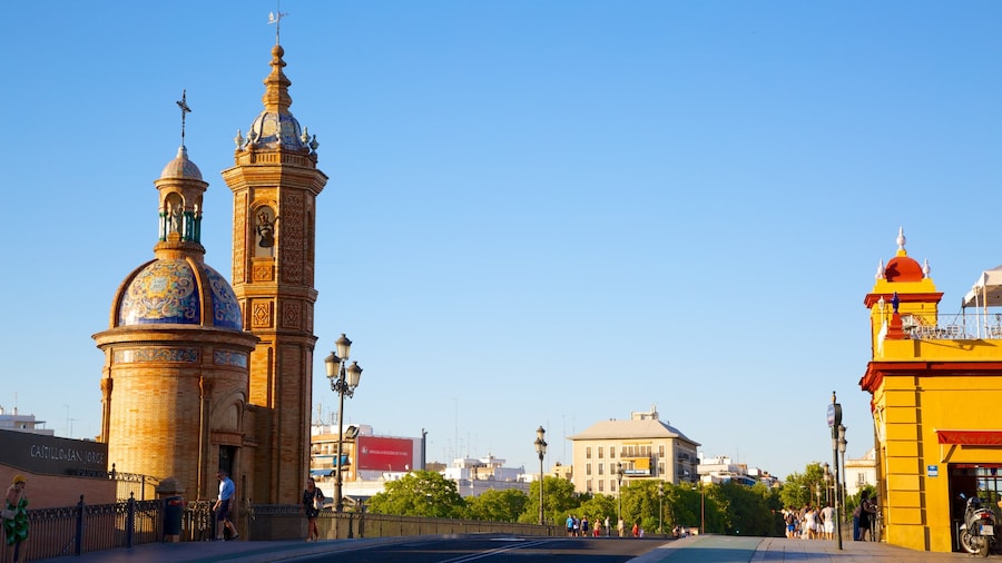 Triana Bridge showing street scenes, a church or cathedral and a bridge