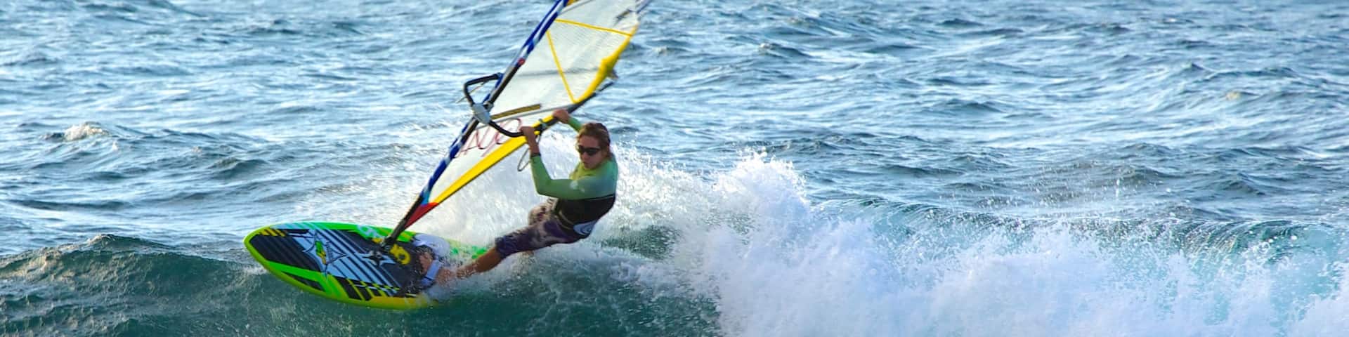Hookipa Beach Park which includes windsurfing and surf as well as an individual male