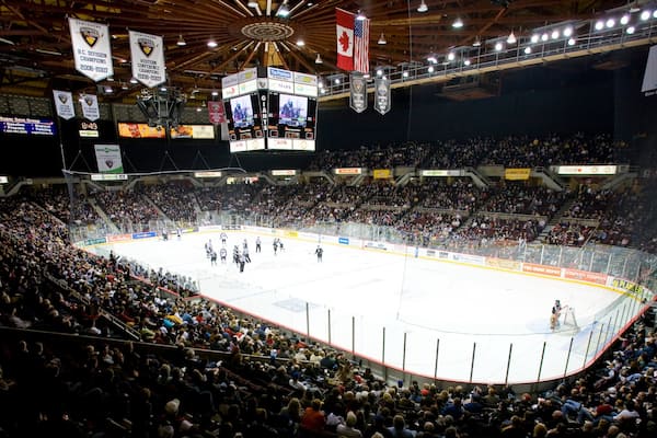 Pacific Coliseum showing a sporting event, interior views and ice skating