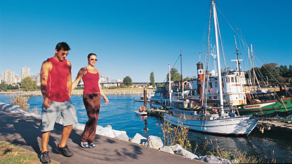 Jericho Beach which includes a garden and a bay or harbor as well as a couple