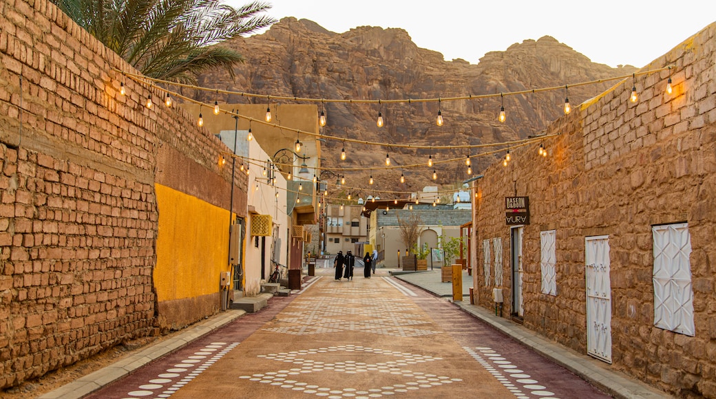 Al Jadidah which includes desert views, street scenes and a gorge or canyon