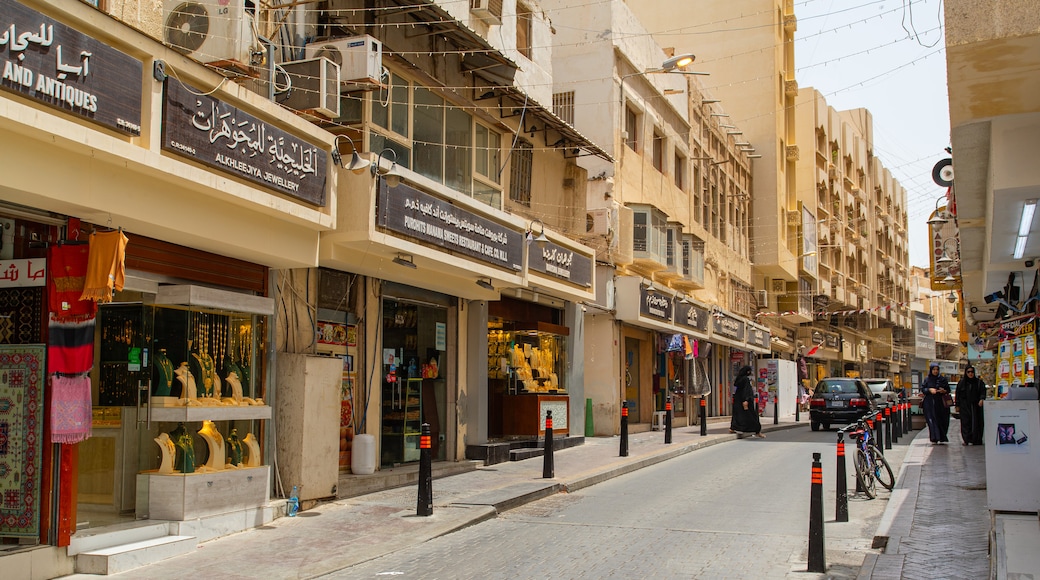 Gold Souq showing street scenes and a city