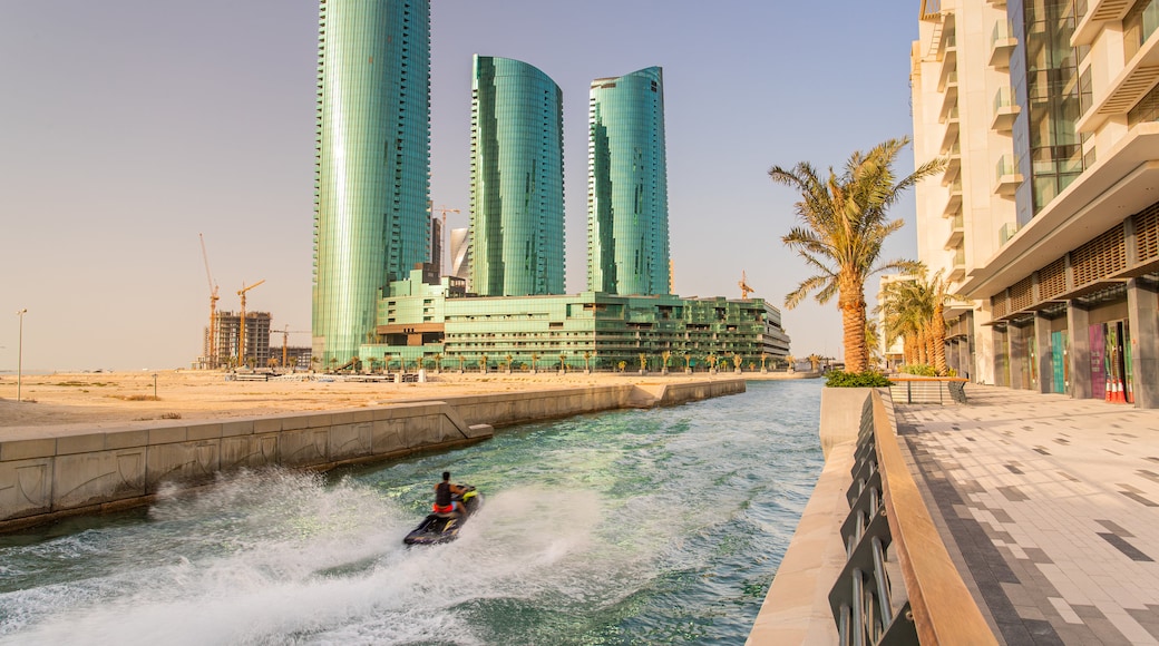 Manama featuring a high rise building, a river or creek and modern architecture