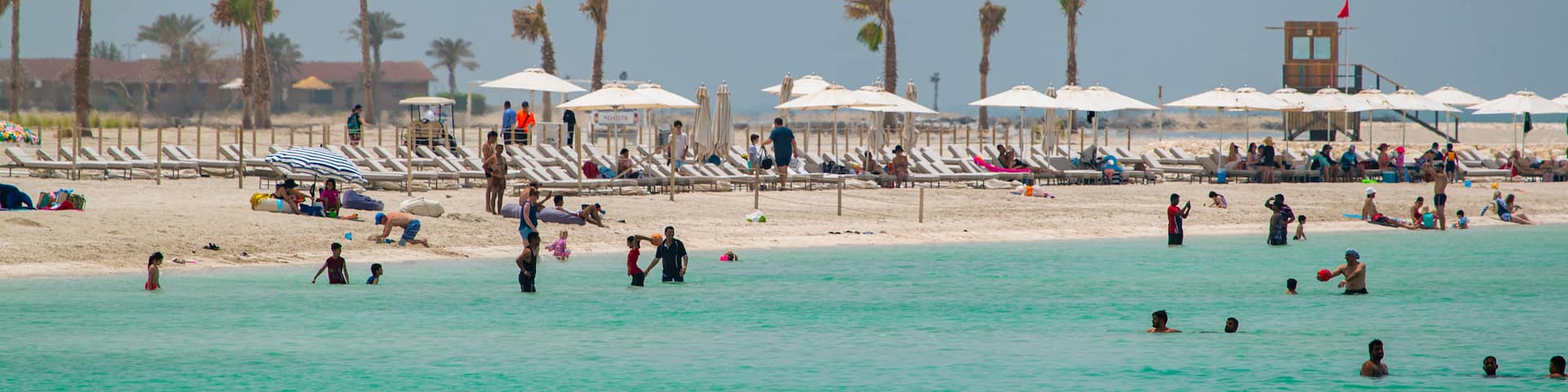 Al Jazaira Beach which includes a beach, general coastal views and swimming