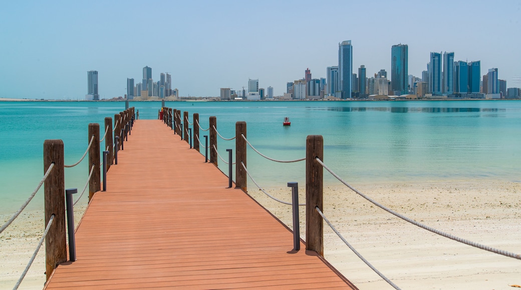 Manama featuring a sandy beach, a city and general coastal views